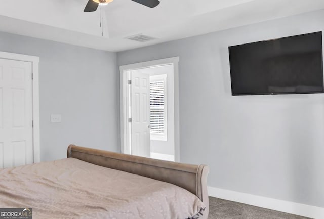 bedroom with ceiling fan and carpet floors