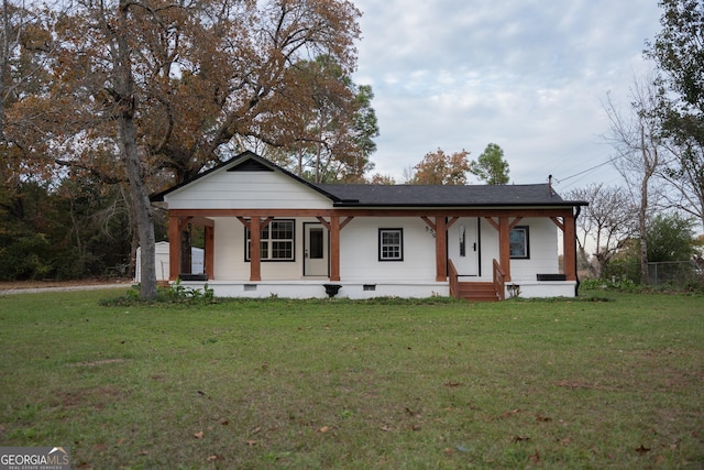 view of front of home featuring a porch and a front lawn