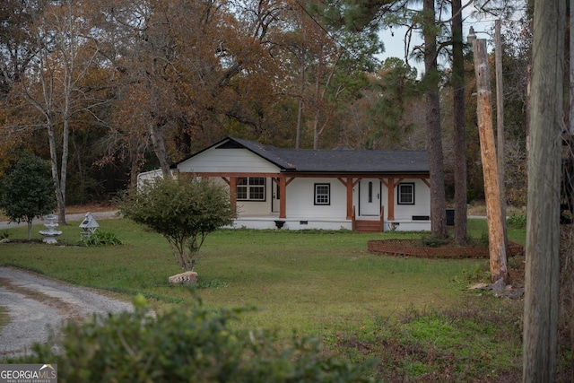 single story home with covered porch and a front yard