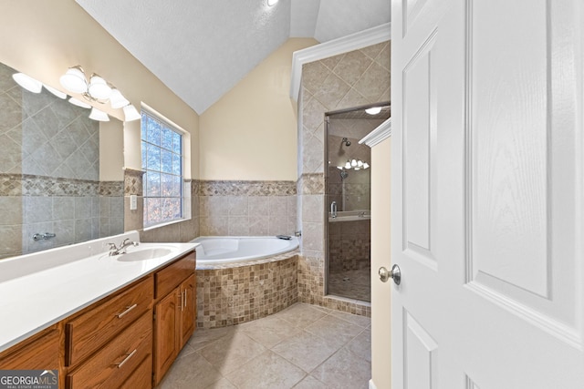 bathroom featuring tile patterned flooring, tile walls, vaulted ceiling, a textured ceiling, and shower with separate bathtub