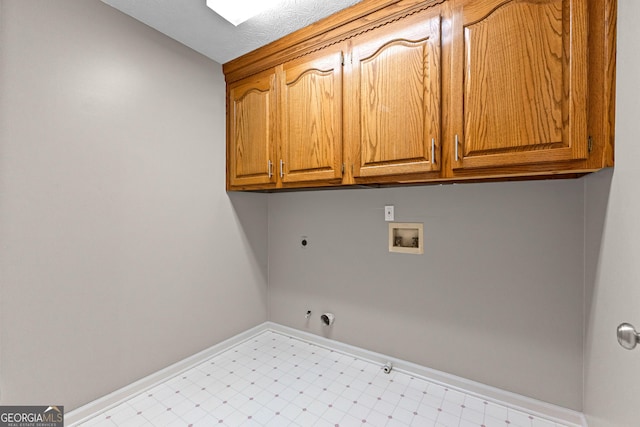 laundry room with electric dryer hookup, hookup for a washing machine, gas dryer hookup, and cabinets