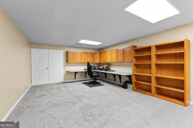 carpeted office with built in desk