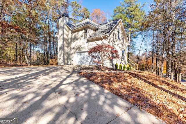 view of side of property with a garage