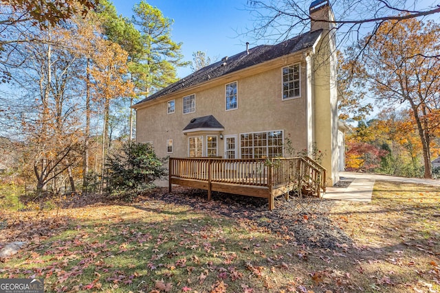 rear view of property with a deck