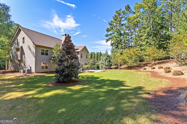 view of yard featuring central AC