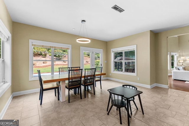 dining room featuring plenty of natural light