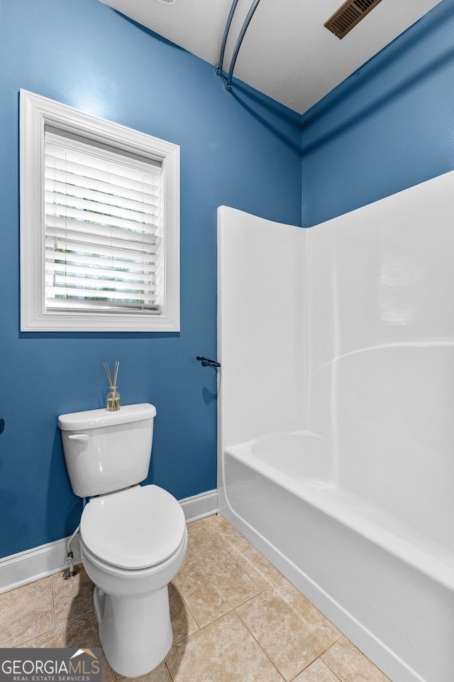 bathroom featuring tile patterned floors and toilet