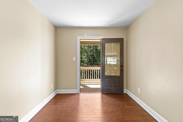 doorway to outside with dark wood-type flooring