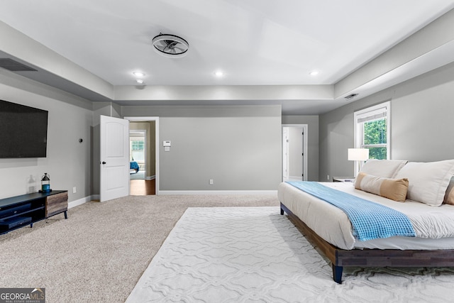 bedroom with light colored carpet