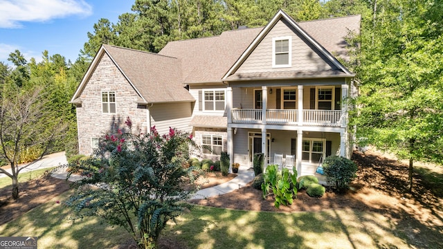 view of front of home with a balcony and covered porch