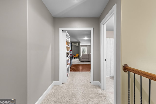 hallway featuring carpet flooring