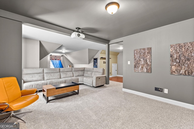 living room with carpet flooring and ceiling fan