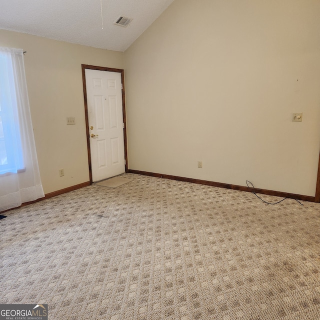 240 Chambers Rd, Mcdonough, GA 30253 - spare room with lofted ceiling and light colored carpet