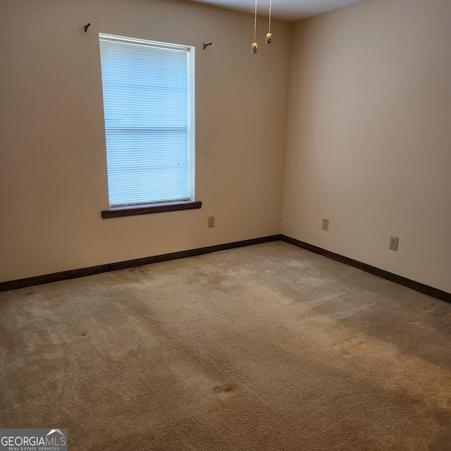 view of carpeted spare room