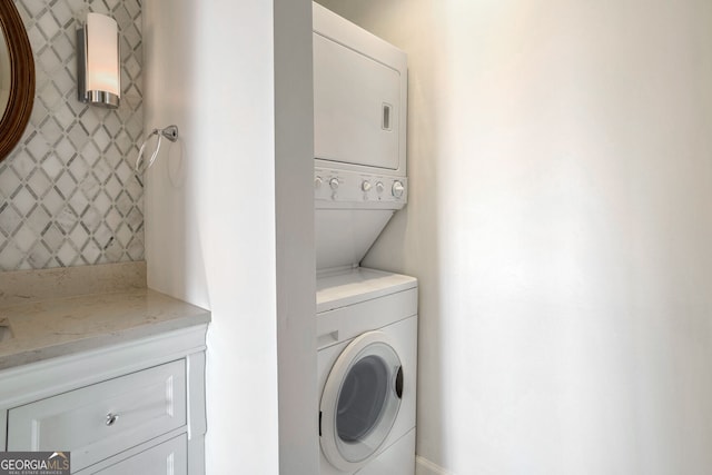 laundry room featuring stacked washing maching and dryer