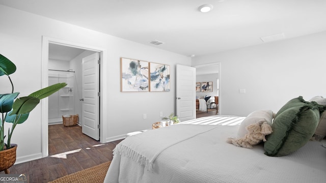 bedroom featuring dark hardwood / wood-style flooring