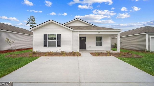 ranch-style house with a porch and a front yard