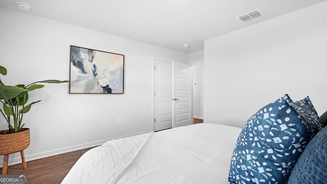 bedroom featuring dark hardwood / wood-style floors