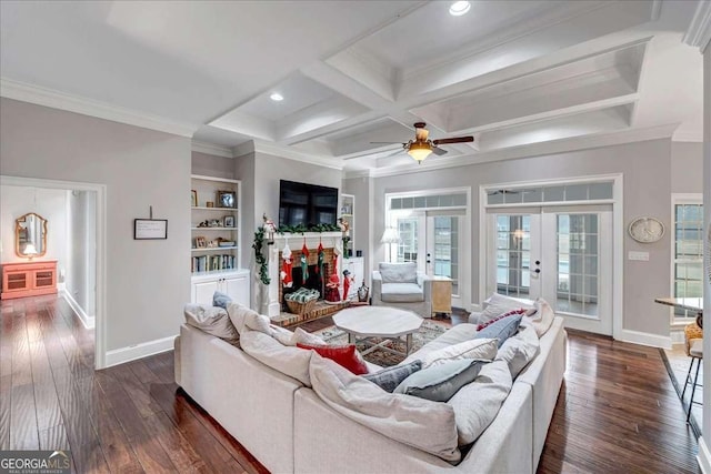 living room with plenty of natural light, dark hardwood / wood-style flooring, and french doors