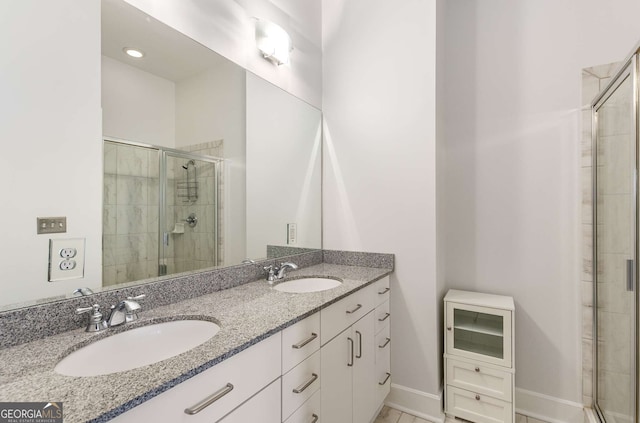 bathroom featuring vanity and a shower with shower door