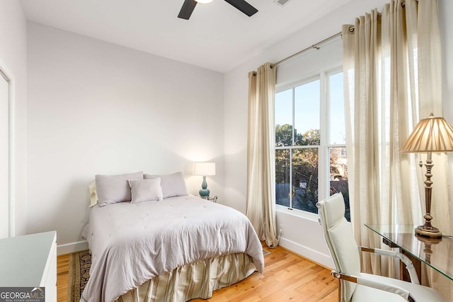 bedroom featuring ceiling fan and light hardwood / wood-style flooring