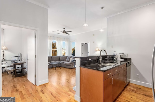 kitchen with kitchen peninsula, stainless steel dishwasher, ceiling fan, sink, and light hardwood / wood-style floors