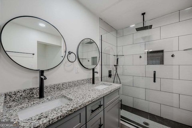 bathroom featuring vanity and an enclosed shower