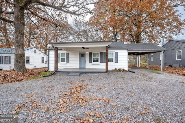 view of front of home featuring covered porch and a carport