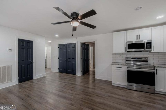 kitchen with ceiling fan, dark hardwood / wood-style flooring, white cabinets, and appliances with stainless steel finishes