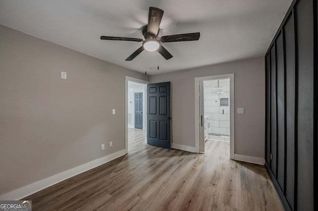 unfurnished bedroom featuring ceiling fan and light hardwood / wood-style floors