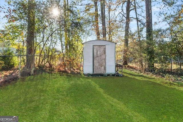 view of outdoor structure with a lawn