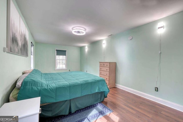 bedroom featuring hardwood / wood-style floors