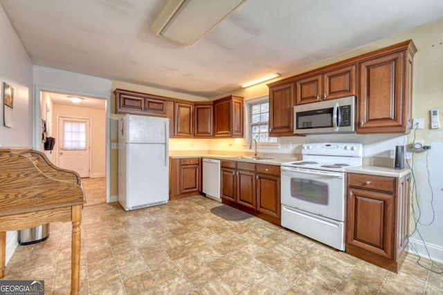 kitchen with white appliances and sink