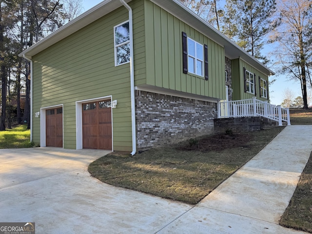 view of side of property with a garage