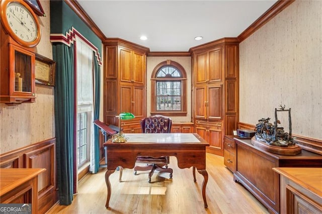 office area with light hardwood / wood-style flooring and ornamental molding