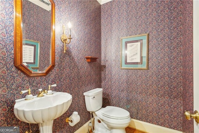 bathroom with sink and toilet