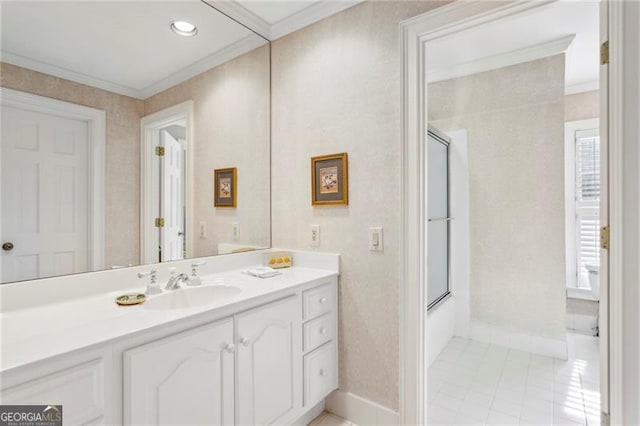 bathroom featuring tile patterned floors, vanity, enclosed tub / shower combo, and crown molding