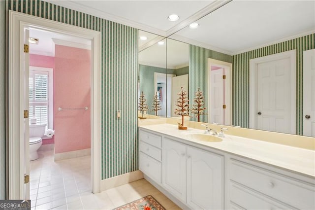 bathroom featuring tile patterned floors, vanity, and toilet