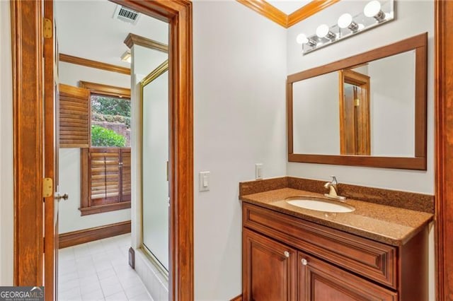 bathroom featuring tile patterned floors, vanity, ornamental molding, and walk in shower