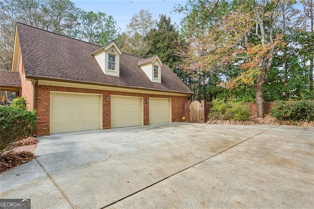 view of property exterior with a garage