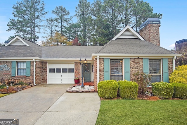 view of front of house featuring a garage and a front yard