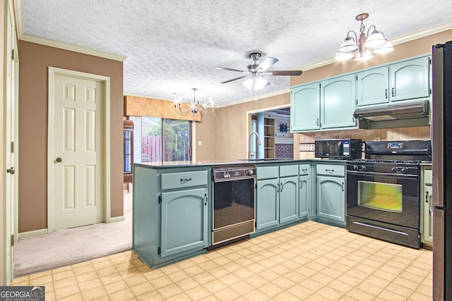 kitchen with pendant lighting, black appliances, ceiling fan with notable chandelier, ornamental molding, and kitchen peninsula