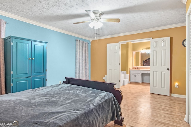 bedroom featuring a textured ceiling, ceiling fan, and ornamental molding