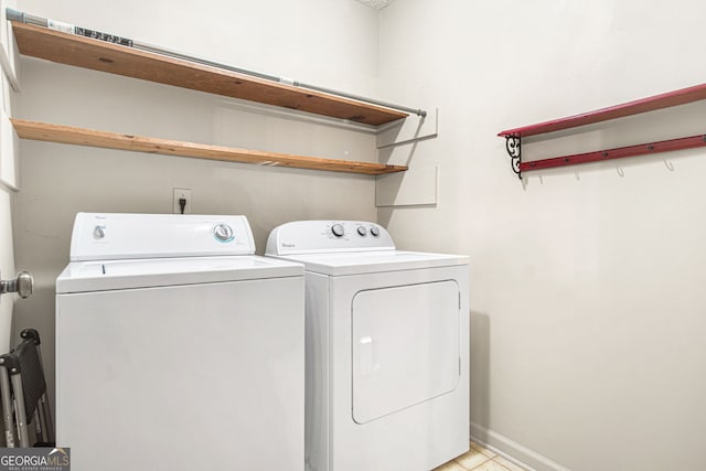 washroom featuring washer and clothes dryer