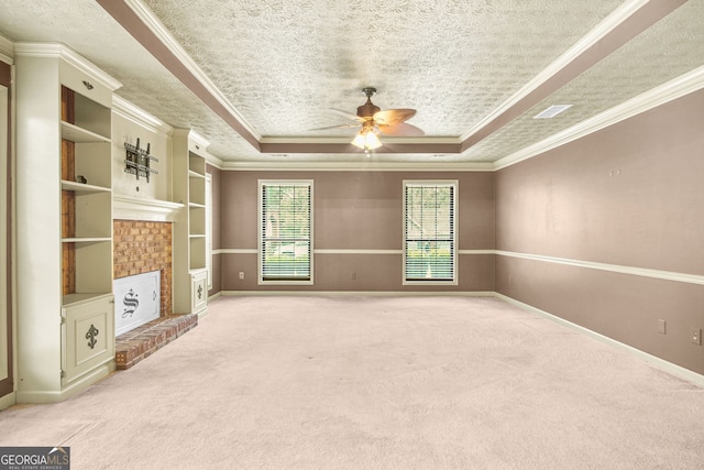 unfurnished living room with ceiling fan, light colored carpet, crown molding, and a tray ceiling