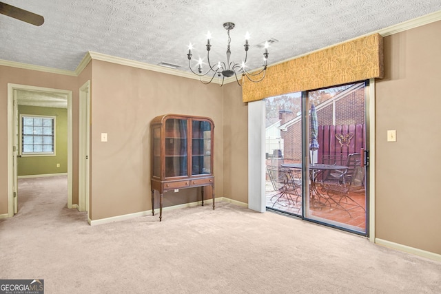 unfurnished dining area with carpet flooring, ceiling fan with notable chandelier, ornamental molding, and a textured ceiling