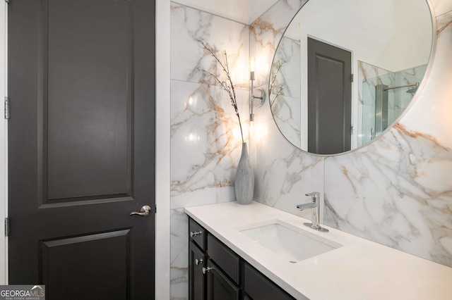 bathroom featuring tasteful backsplash and vanity