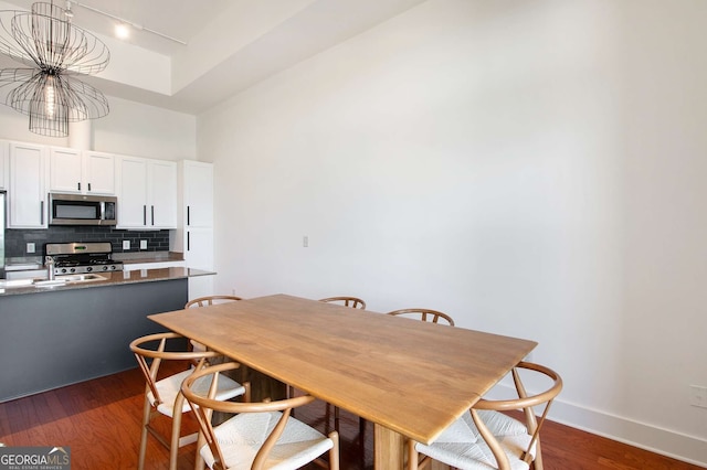 dining room with dark hardwood / wood-style floors