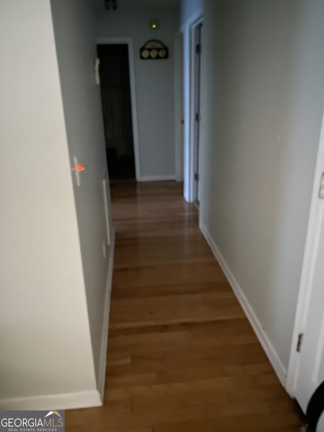 corridor featuring hardwood / wood-style floors