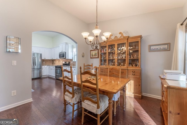 dining space featuring a chandelier and dark hardwood / wood-style floors